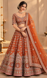 Orange Bridal Lehenga with Silver Embroidery & Embellished Dupatta