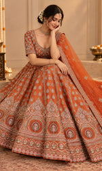 Orange Bridal Lehenga with Silver Embroidery & Embellished Dupatta