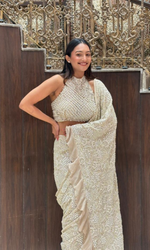 Cream embellished Saree with halter blouse