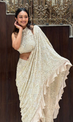 Cream embellished Saree with halter blouse